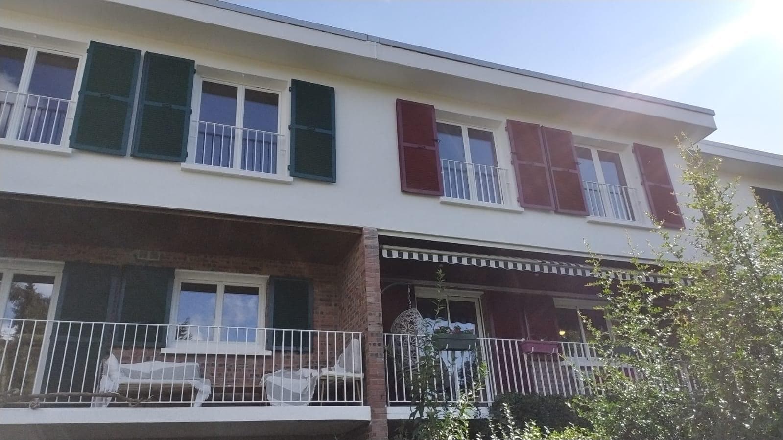 Repainted upper floor, shutters and white railings