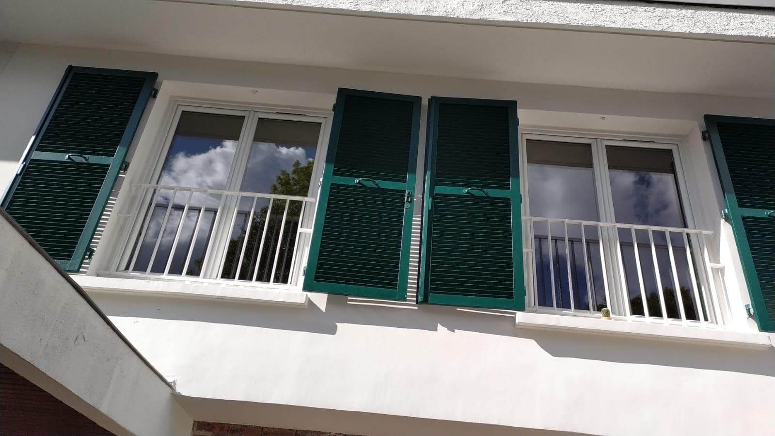Close-up of the louvred shutters and railings